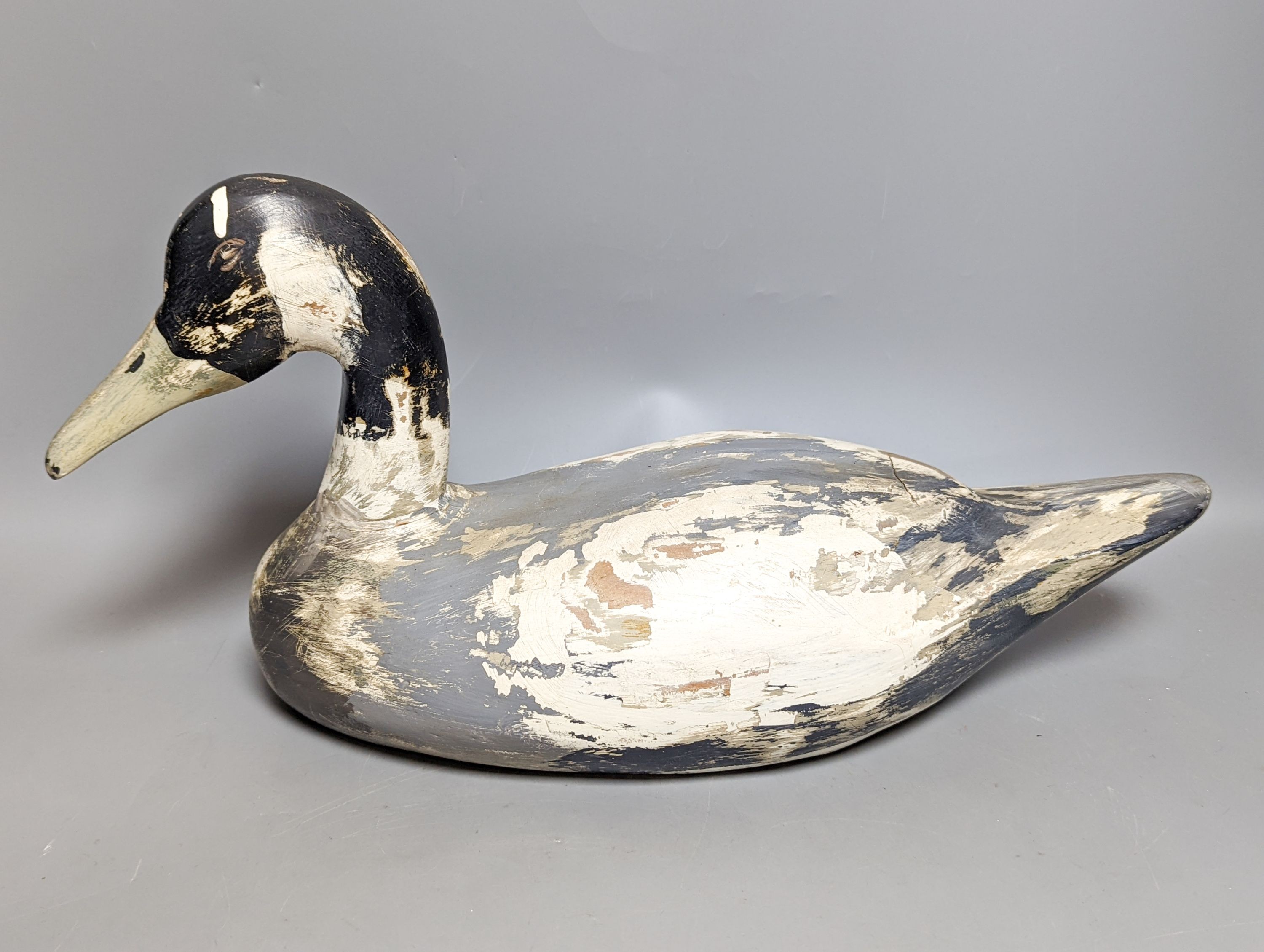 A modern painted decoy duck and a 20th century Chinese ceramic model duck (2) 42cm